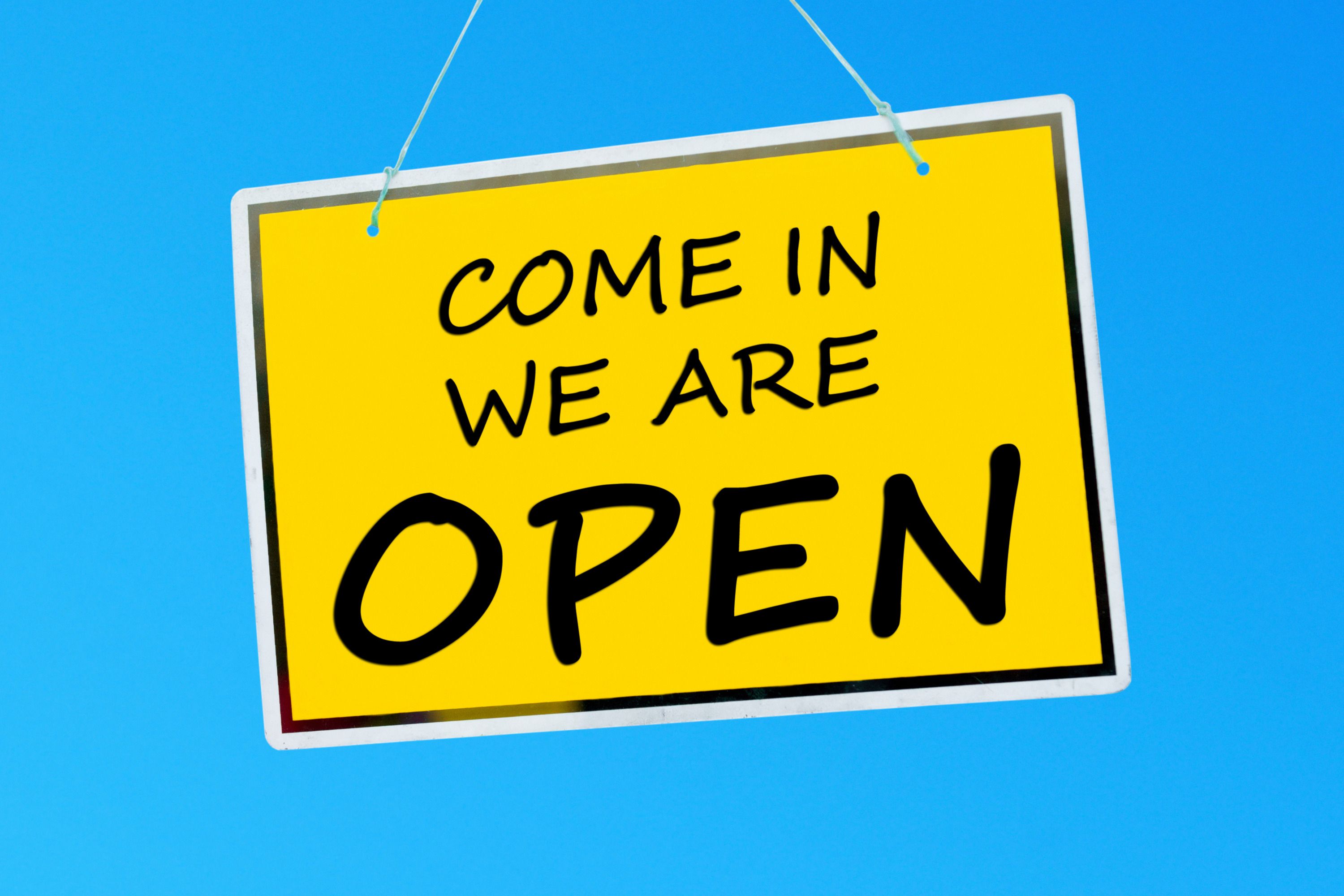 Sign depicting come in, we are open for business 24 hours per day, 7 days per week, 365 days per year